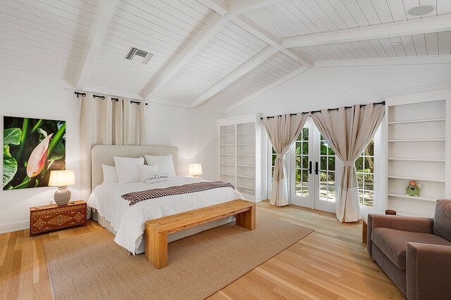 bedroom featuring lofted ceiling with beams, light hardwood / wood-style floors, french doors, and access to outside