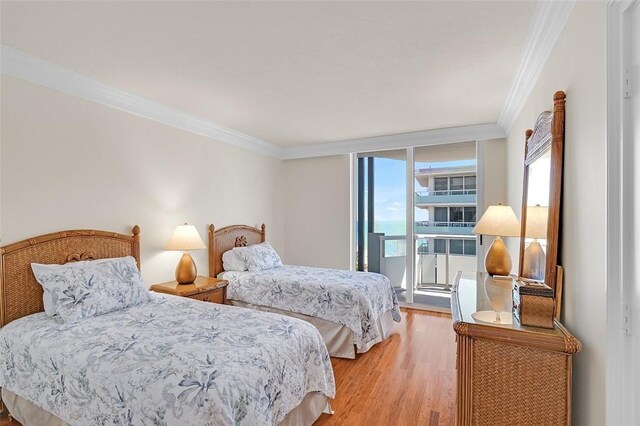 3554 S Ocean Dr Unit 1203, Vero Beach, FL 32963 - bedroom featuring ornamental molding and light wood-style floors