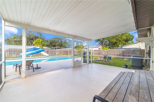 view of patio featuring a fenced in pool