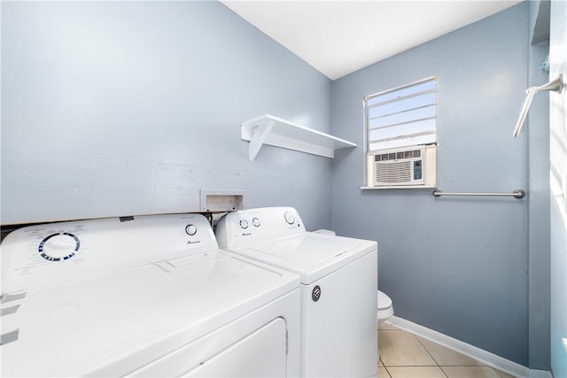 washroom featuring separate washer and dryer, cooling unit, and light tile patterned floors