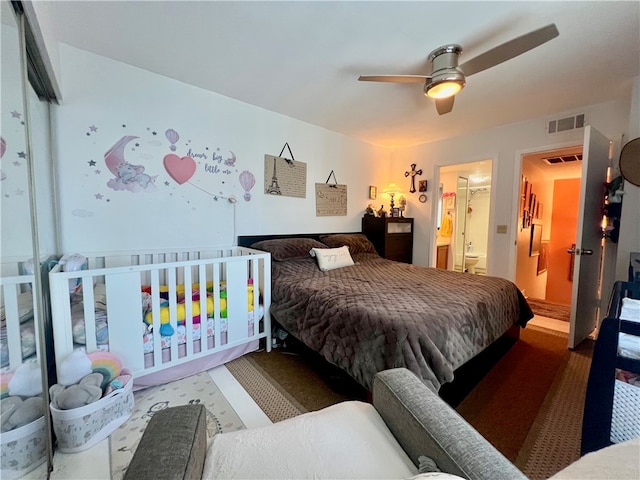 bedroom with ensuite bathroom and ceiling fan