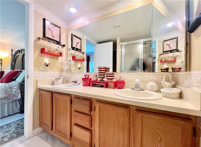 bathroom featuring vanity and a shower with shower door