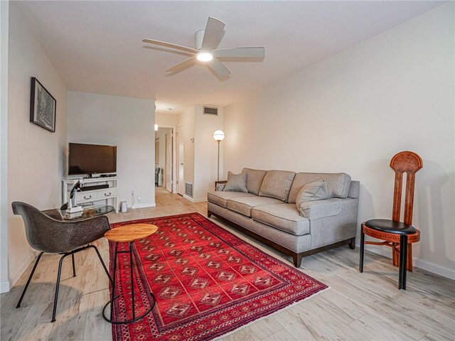 85 Crooked Tree Ln Unit 203, Vero Beach, FL 32962 - living area featuring baseboards, ceiling fan, wood finished floors, and visible vents
