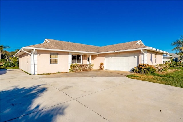 ranch-style house featuring a garage