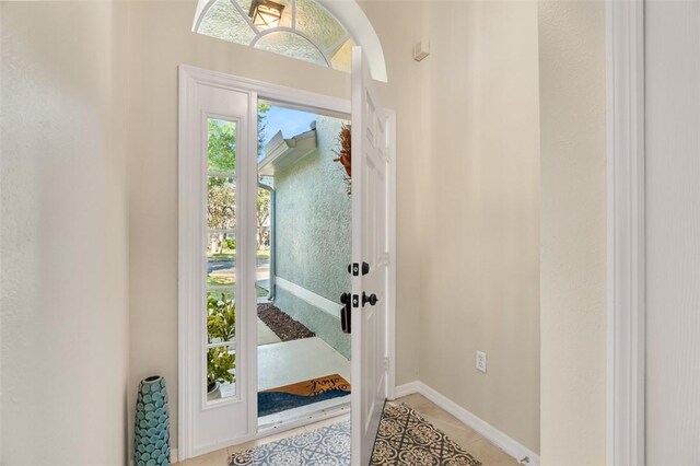 entrance foyer with light tile patterned floors