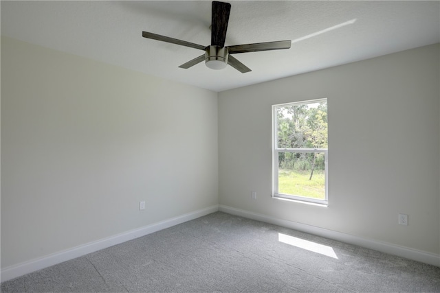 empty room with carpet flooring and ceiling fan