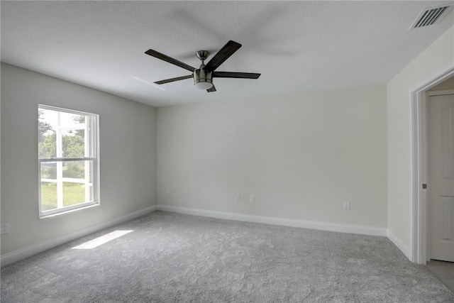 carpeted empty room with ceiling fan