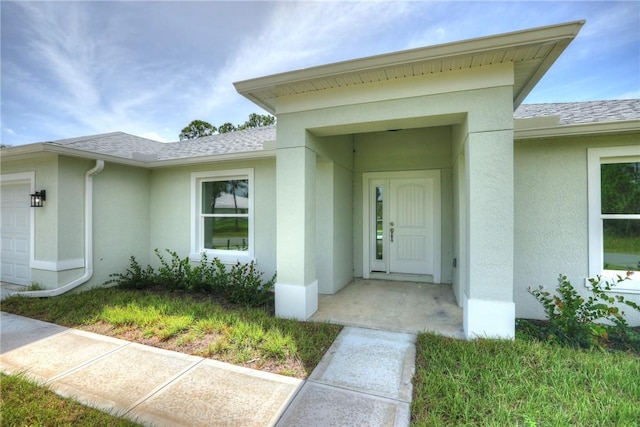 doorway to property featuring a garage