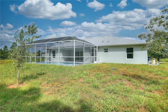 back of property with a lanai