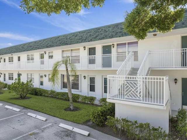 2800 Indian River Blvd Unit N2, Vero Beach, FL 32960 - view of property featuring uncovered parking
