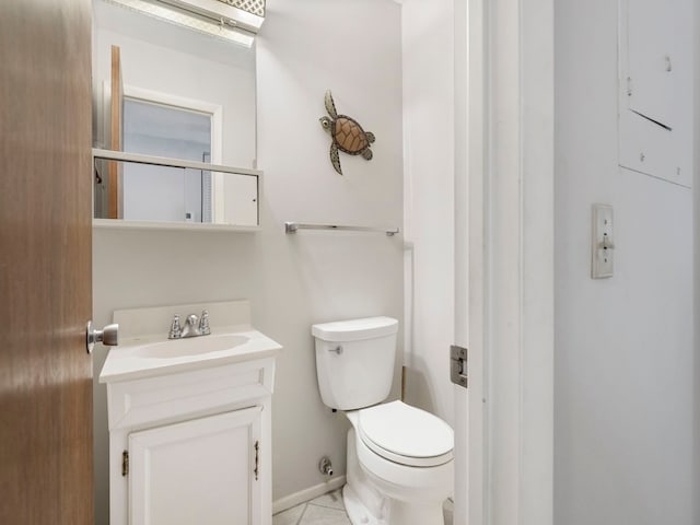 bathroom with tile patterned floors, vanity, and toilet