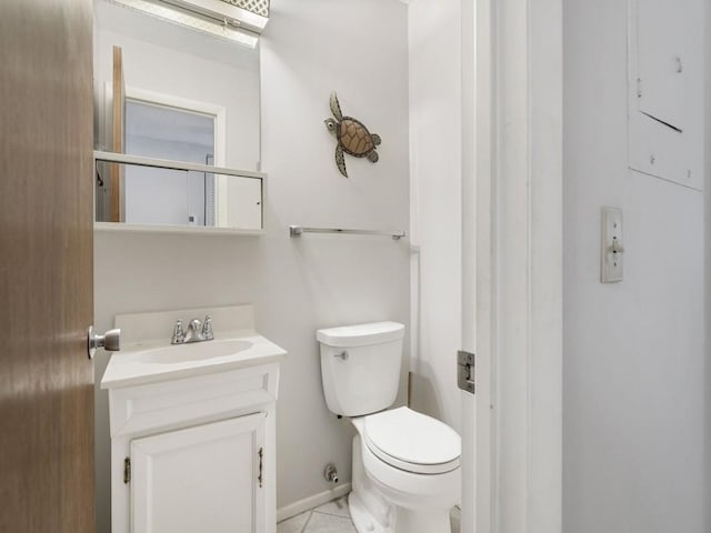 2800 Indian River Blvd Unit N2, Vero Beach, FL 32960 - bathroom featuring toilet, vanity, and baseboards
