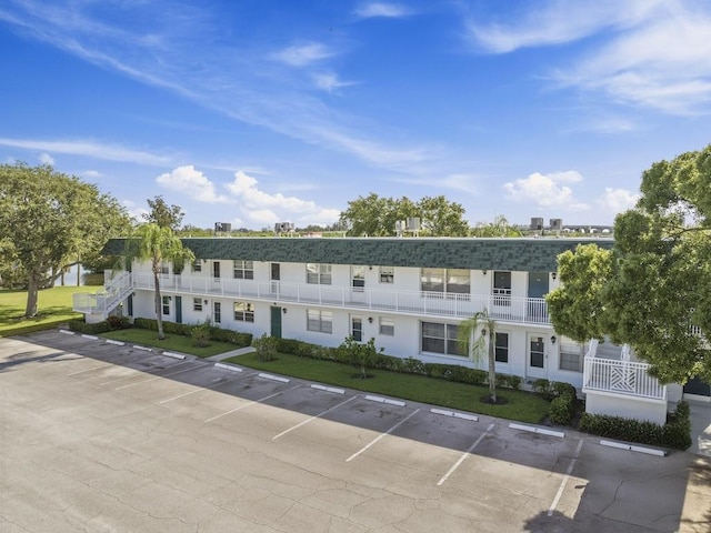 2800 Indian River Blvd Unit N2, Vero Beach, FL 32960 - view of building exterior with uncovered parking