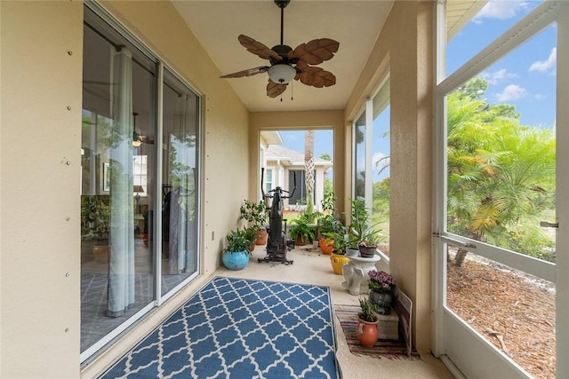 sunroom / solarium with ceiling fan