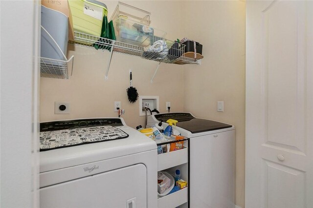 laundry area featuring washing machine and dryer