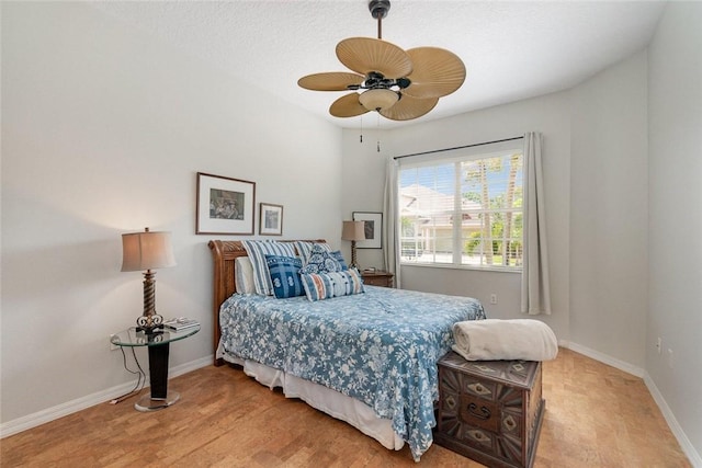 bedroom with ceiling fan and light hardwood / wood-style floors