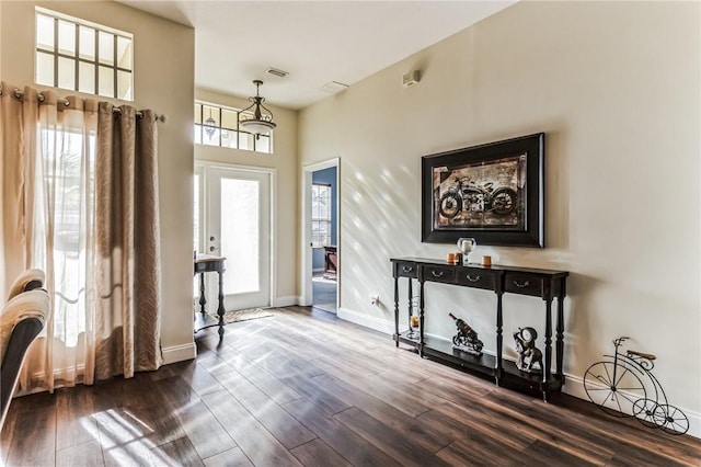 entryway with hardwood / wood-style floors