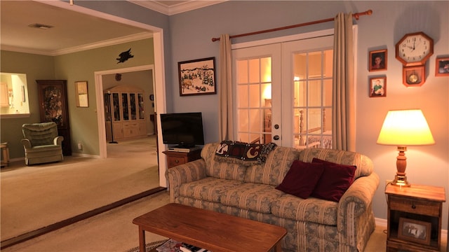 carpeted living room featuring french doors and ornamental molding