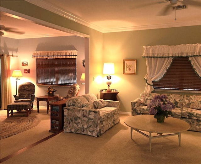 living room featuring ceiling fan, carpet flooring, and ornamental molding