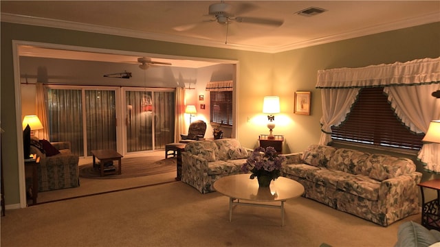 living room featuring ornamental molding, light carpet, and ceiling fan