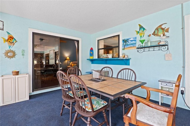 2033 Thistle Dr, Melbourne, FL 32935 - dining room with carpet flooring and a textured ceiling