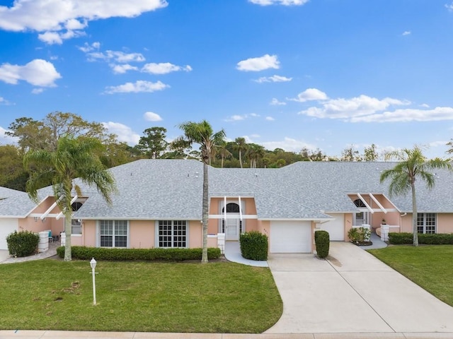 single story home featuring stucco siding, a shingled roof, a garage, driveway, and a front lawn