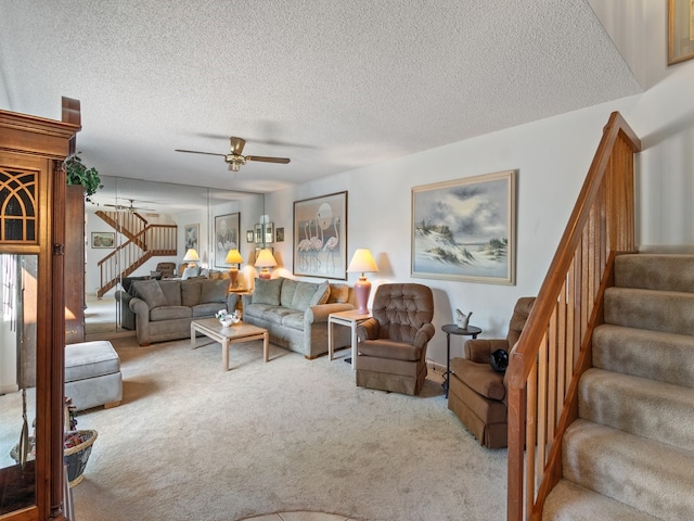 carpeted living room with a textured ceiling and ceiling fan