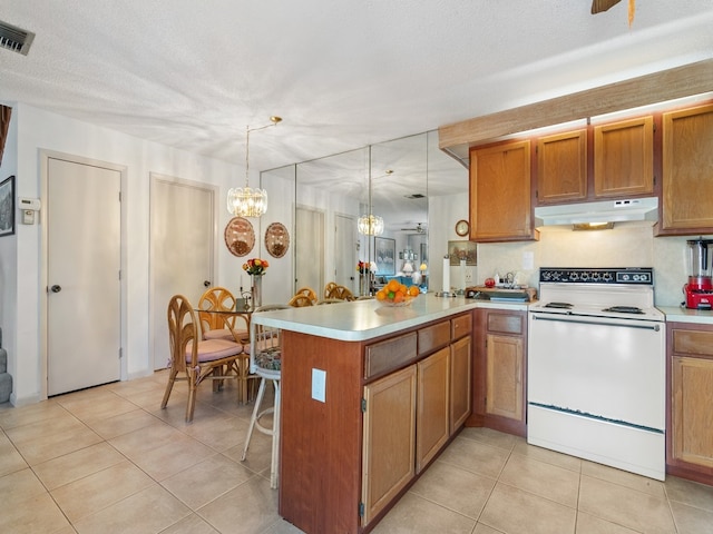 kitchen with a textured ceiling, kitchen peninsula, hanging light fixtures, and white electric range oven