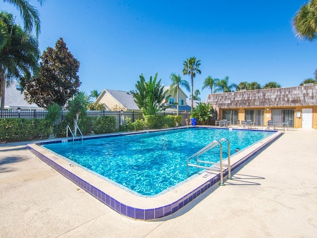 view of swimming pool with a patio