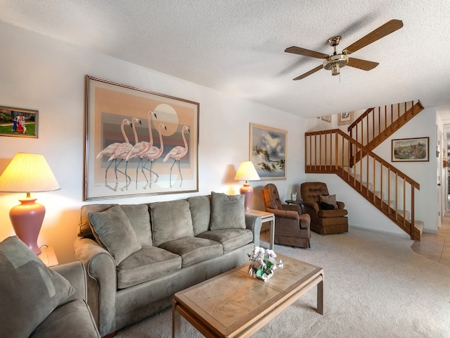 carpeted living room with a textured ceiling and ceiling fan