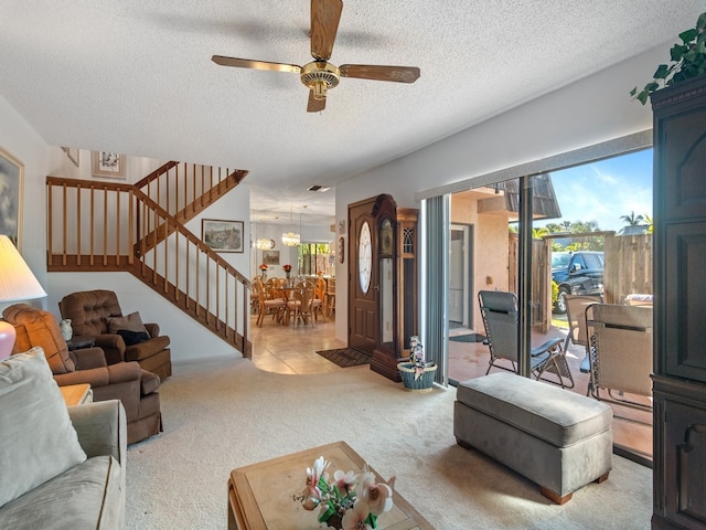 carpeted living room with a textured ceiling and ceiling fan