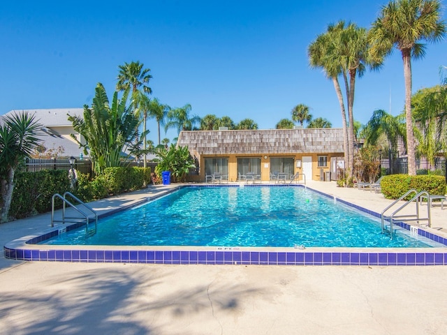 view of swimming pool featuring a patio area