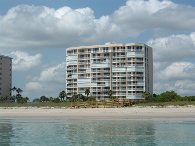 exterior space with a beach view and a water view