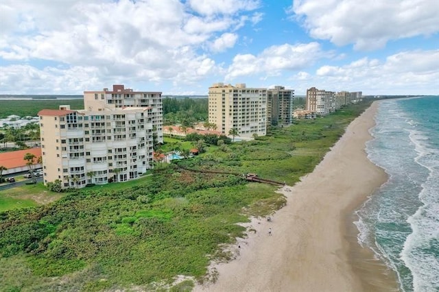 aerial view featuring a view of the beach and a water view