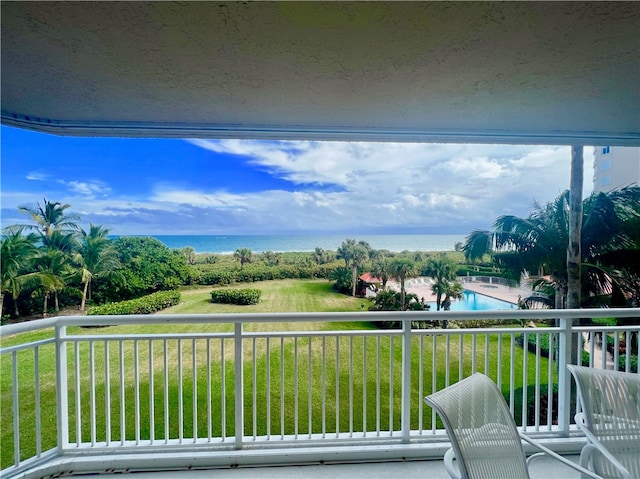 balcony featuring a water view