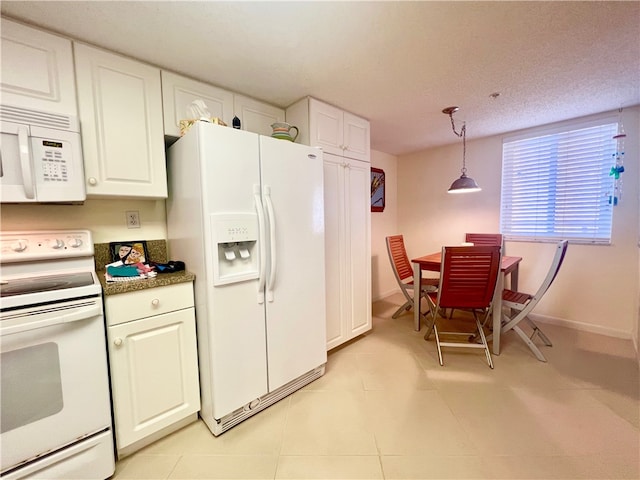 kitchen featuring white cabinets, white appliances, a textured ceiling, and decorative light fixtures