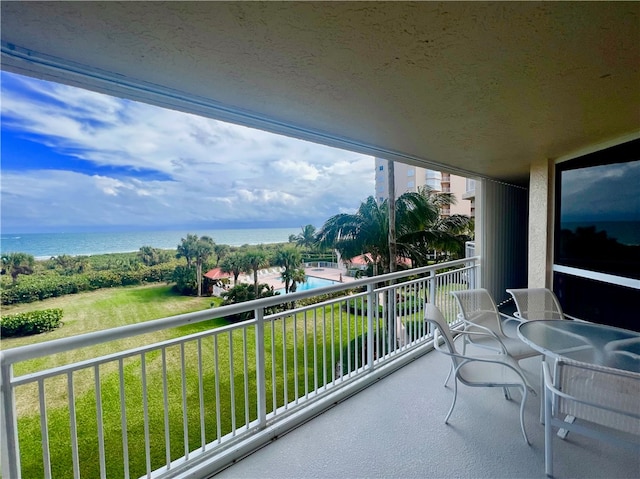 balcony featuring a water view