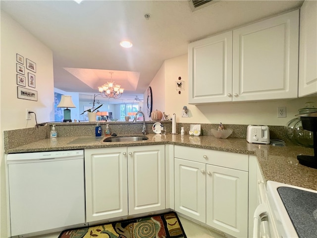 kitchen with dishwasher, sink, a chandelier, and white cabinets