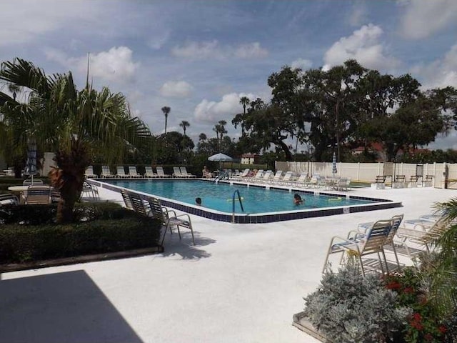 view of swimming pool with a patio area