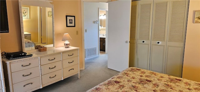 carpeted bedroom featuring a closet