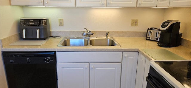 kitchen featuring white cabinets, stove, black dishwasher, and sink