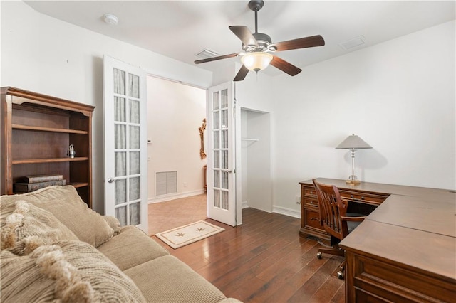 office featuring ceiling fan, french doors, dark wood finished floors, and visible vents