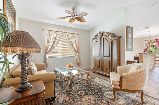 living area featuring light tile patterned floors and a ceiling fan