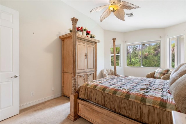 bedroom with visible vents, a ceiling fan, light carpet, vaulted ceiling, and baseboards