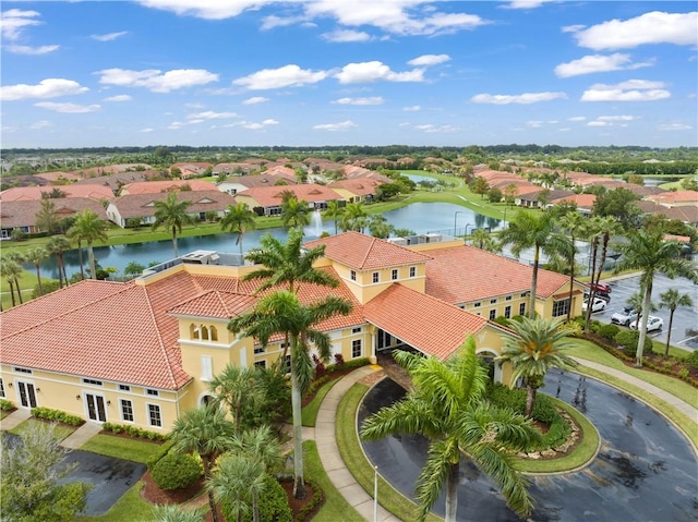 bird's eye view featuring a water view and a residential view