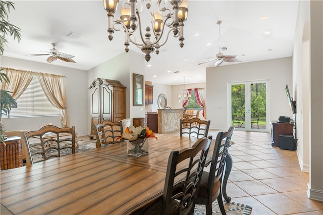 dining space featuring ceiling fan with notable chandelier, visible vents, french doors, and light tile patterned flooring