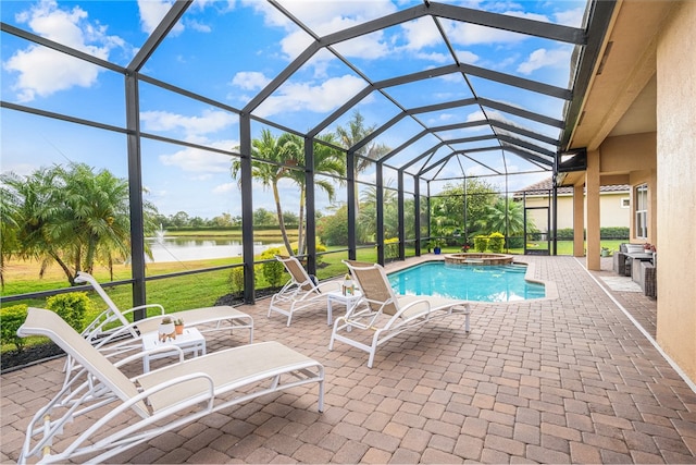 view of swimming pool featuring a lawn, glass enclosure, a patio area, and a water view