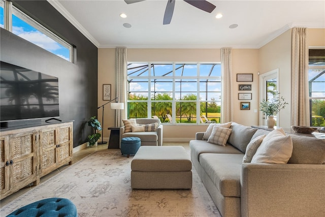 living room featuring ceiling fan and ornamental molding