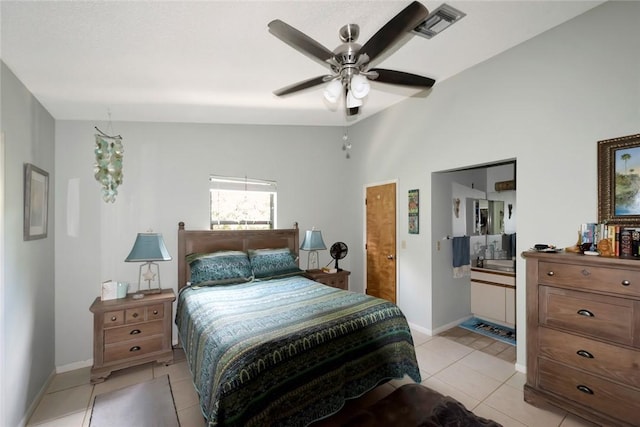 tiled bedroom with ceiling fan and vaulted ceiling