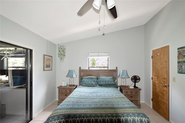 bedroom with ceiling fan, vaulted ceiling, multiple windows, and light tile patterned floors